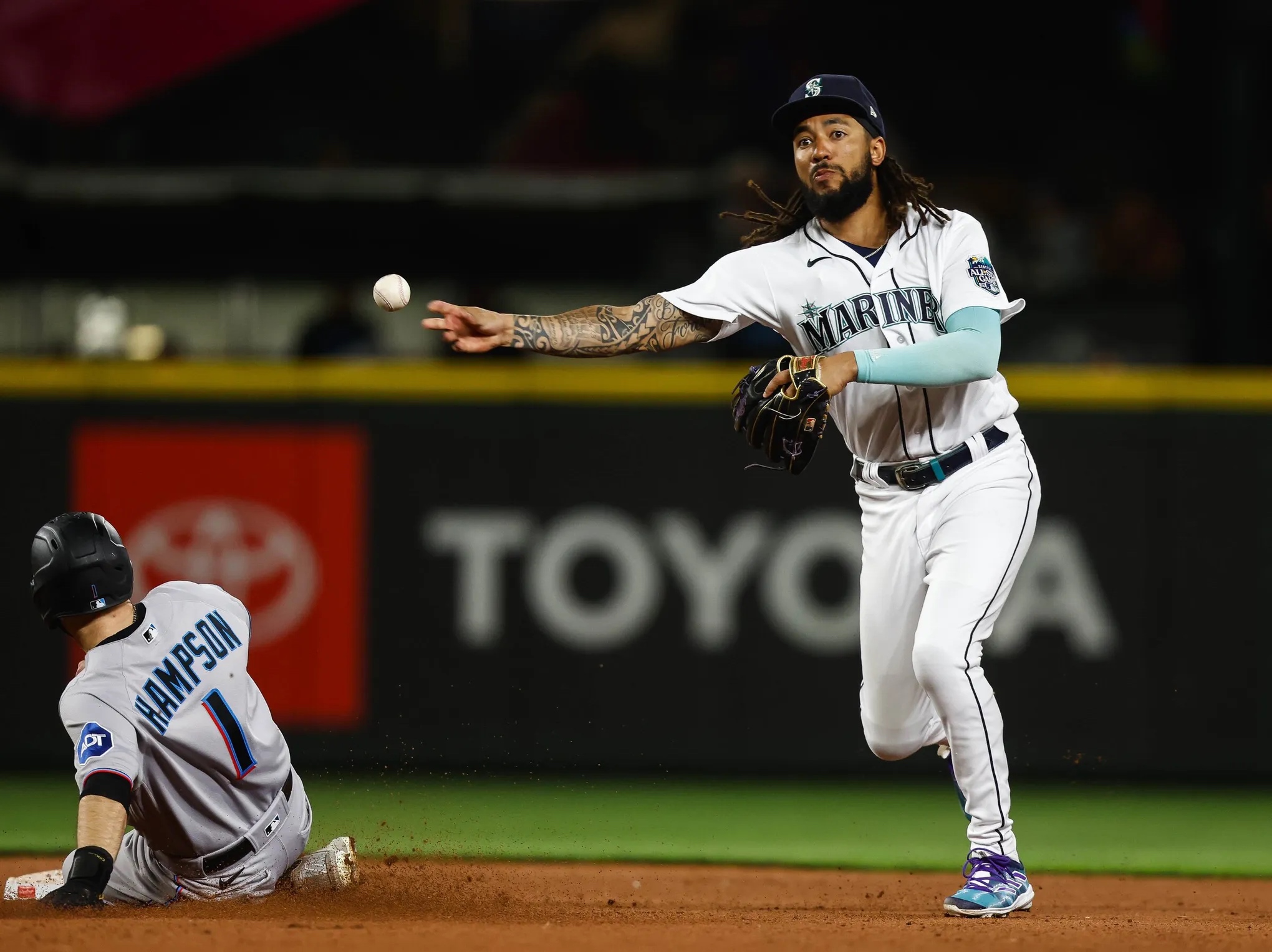 J.P. Crawford throws the ball across the infield.