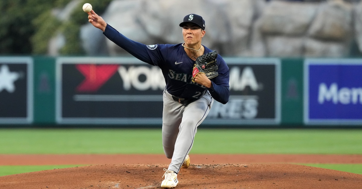 Bryan Woo throwing a fastball, front view.